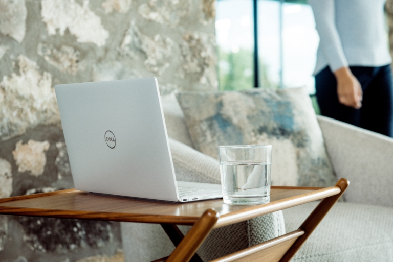 A virtual assistant approaches their laptop