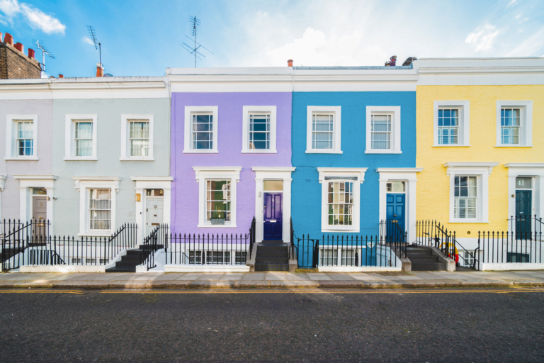 A street of colourful British house facades
